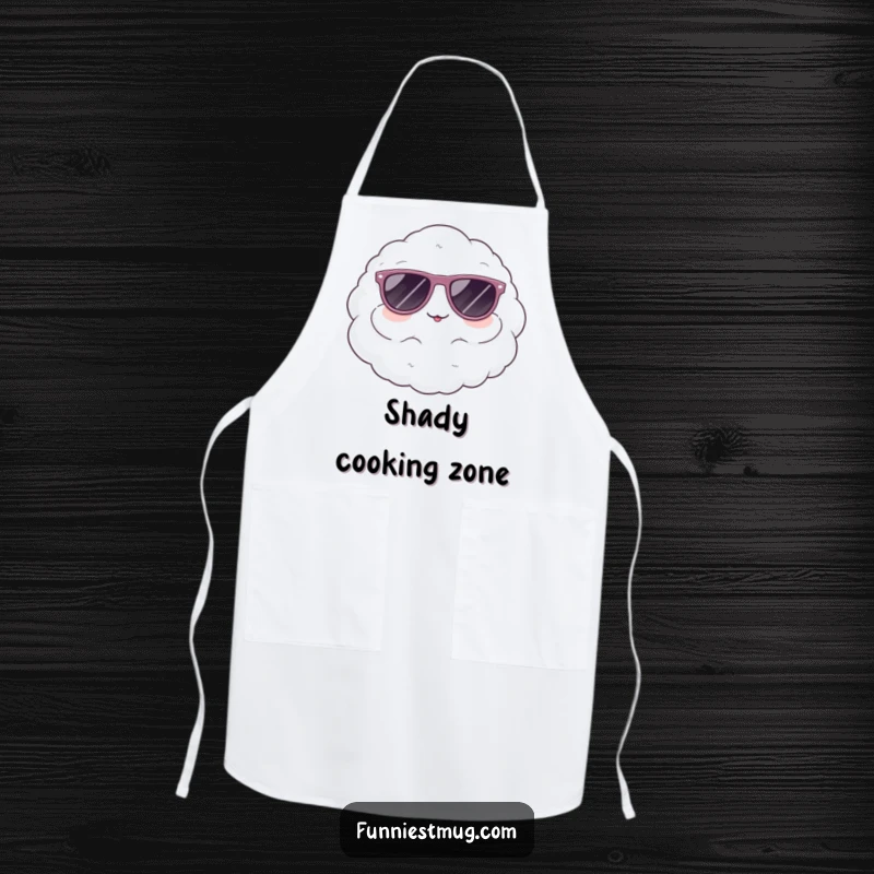 Funny apron depicting a cute, fluffy cloud character comically wearing oversized sunglasses, a cool kitchen accessory.