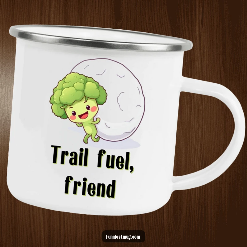 Funny camping mug showing a hopeful broccoli floret character pushing a giant snowball uphill, perfect for outdoor endeavors.