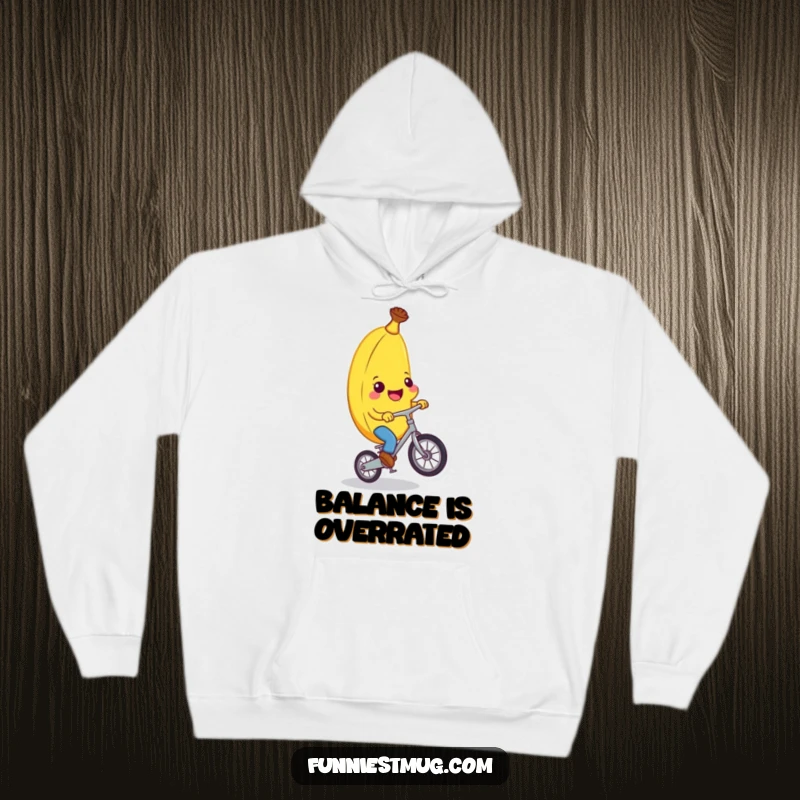 Funny banana character sweating slightly but grinning on a unicycle, offering warmth and humor in this funny hoodie design.