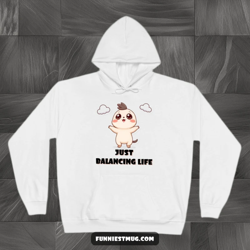 Funny Googly Eyed Creature Hoodie, perfectly depicting the creature's teacup juggling, offering comfort and a humorous visual.