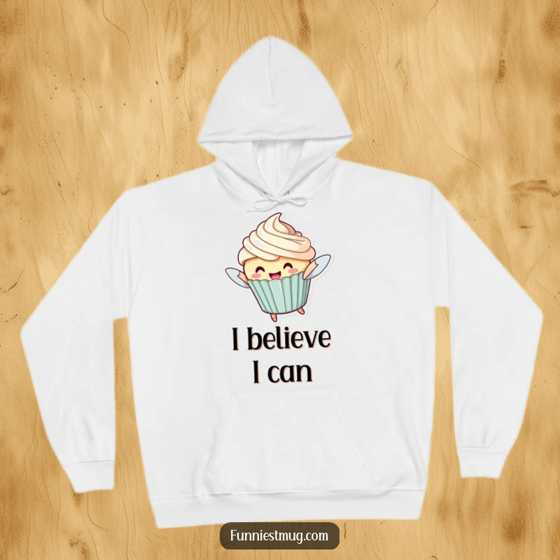 Funny Flying Cupcake Hoodie: A cheerful cupcake character with oversized frosting attempting to fly, perfect for cozy fun.