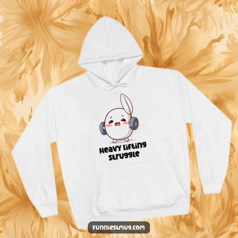 Funny Kawaii dumbbell character straining to lift a feather, offering a warm and humorous design on a cozy hoodie.