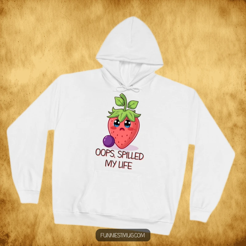 Funny strawberry character in a dramatic slip on a grape, depicted on a soft hoodie for cozy laughs and humorous protection.
