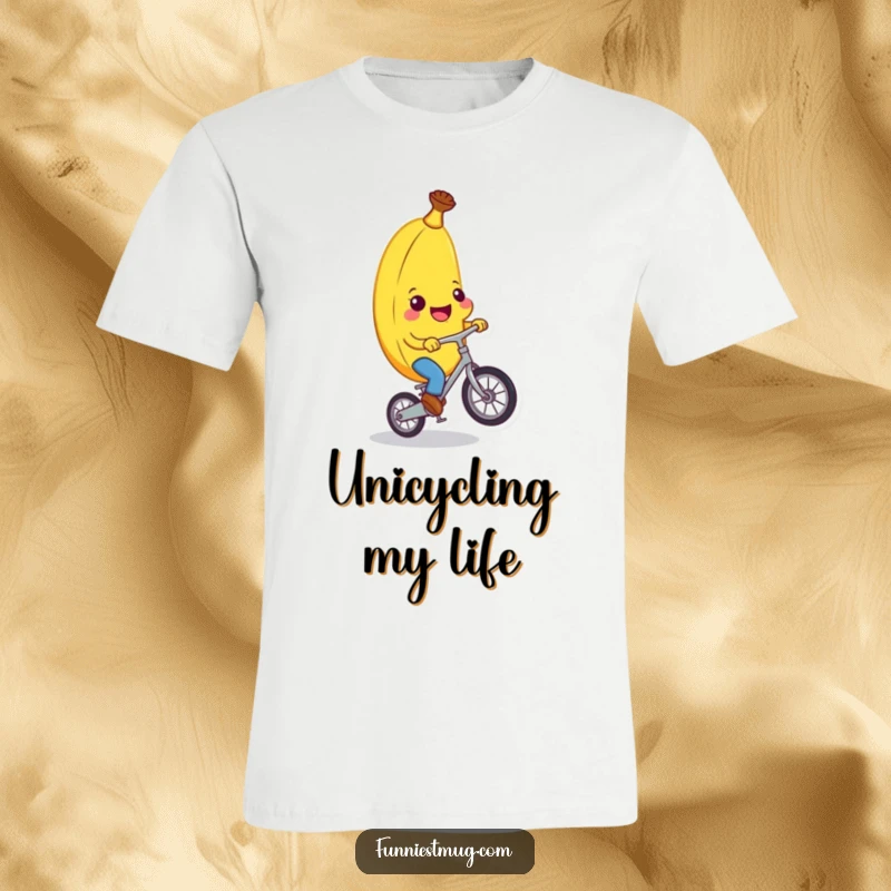 Funny banana character grinning widely while precariously balancing on a small unicycle, a hilarious statement for a funny t-shirt.