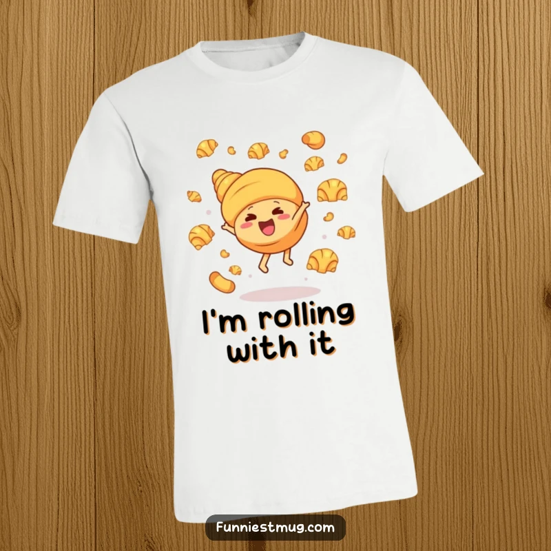 Funny t-shirt with a giggling croissant character doing a cartwheel, butter croissants scattered comically, showcasing a vibrant and humorous bakery scene.