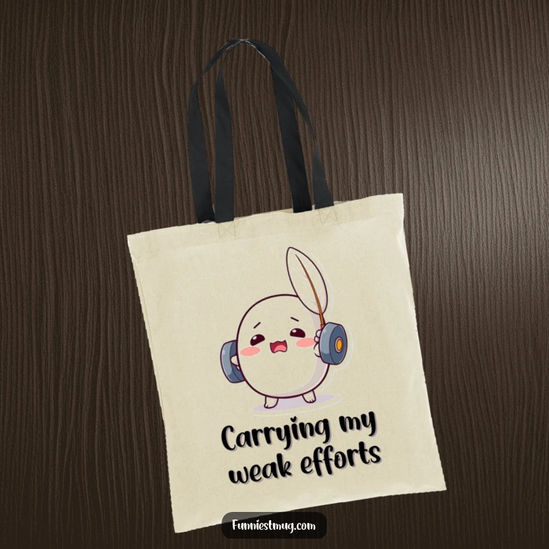 Funny Kawaii dumbbell character straining to lift a feather, featured on a practical and humorous tote bag.
